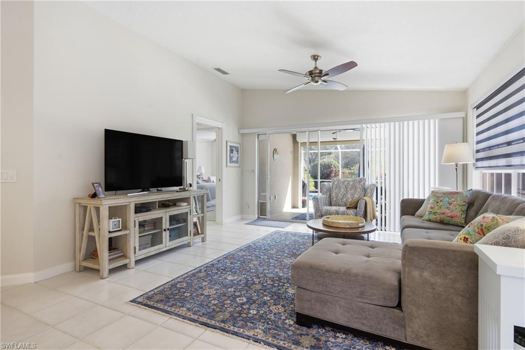 3614 El Segundo Court Naples, FL 34109 - Photo 5 of 49 a living room with furniture and a flat screen tv