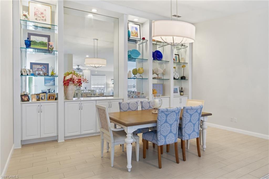 3614 El Segundo Court Naples, FL 34109 - Photo 10 of 49 a view of dining room and kitchen with furniture