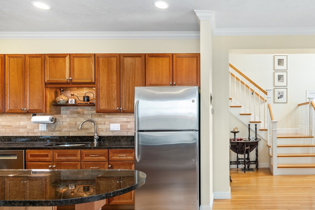 6 Essex Road, Unit 8 Ipswich, MA 01938 - Photo 5 of 35 a kitchen with stainless steel appliances granite countertop a refrigerator and a sink