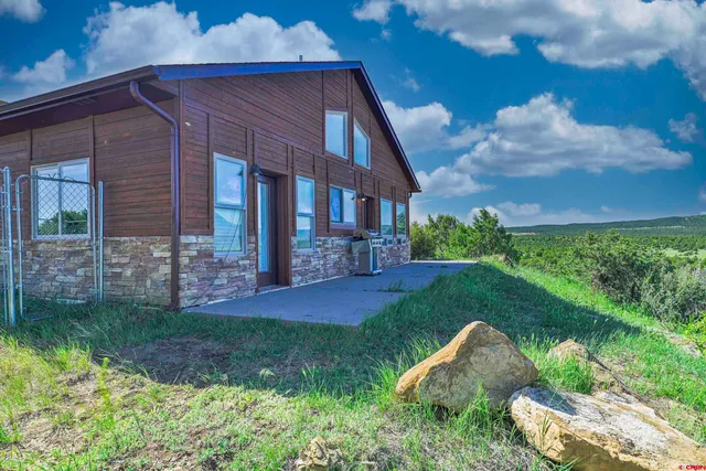 a backyard of a house with lots of green space