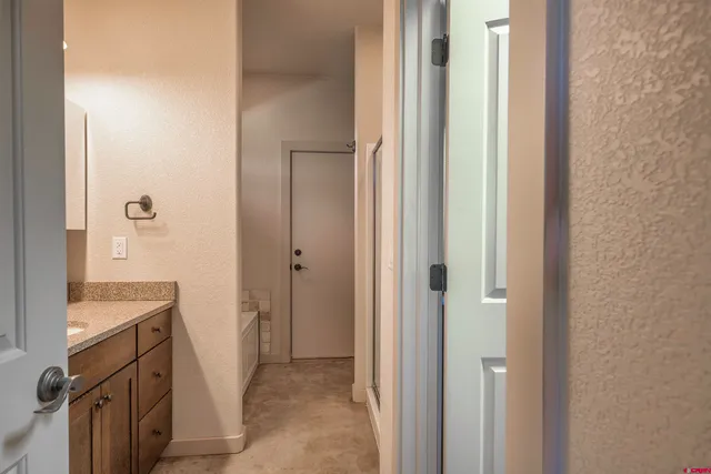 a view of a kitchen from the hallway