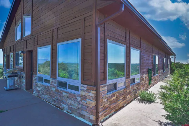 a view of a brick house with a large windows