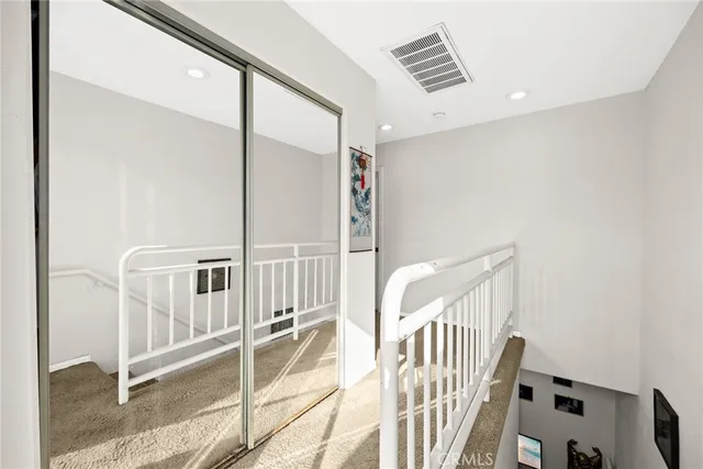 a bedroom with a bed a table and chair