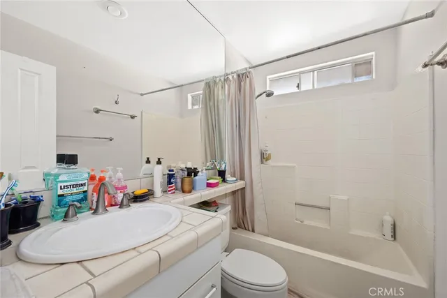 a bed room with furniture and a window