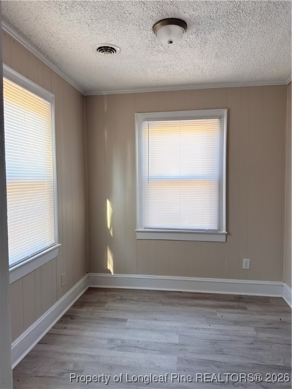 307 Hawthorne Road Fayetteville, NC 28301 - Photo 3 of 11 a view of an empty room with wooden floor and a window