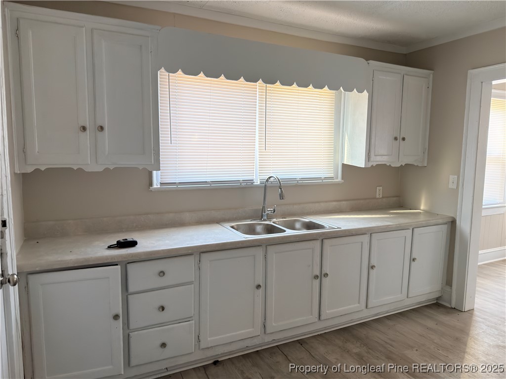 307 Hawthorne Road Fayetteville, NC 28301 - Photo 5 of 11 a kitchen with appliances cabinets and a sink