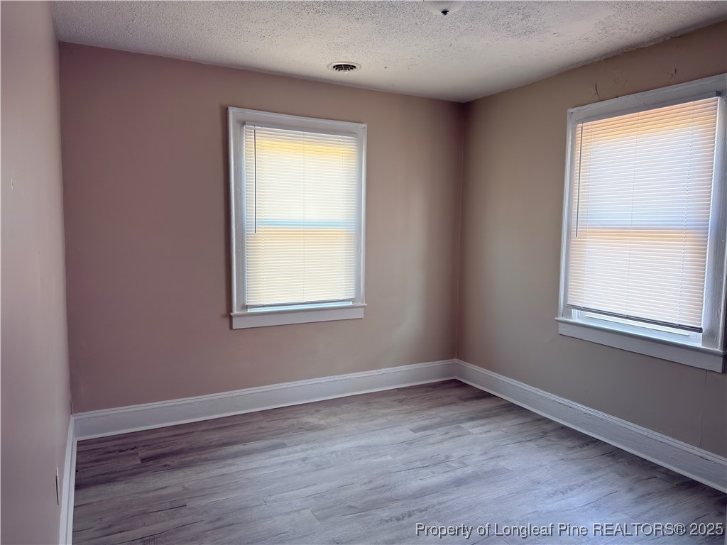 307 Hawthorne Road Fayetteville, NC 28301 - Photo 9 of 11 an empty room with a window