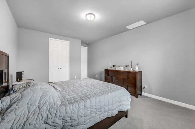 a bedroom with a bed and a tv