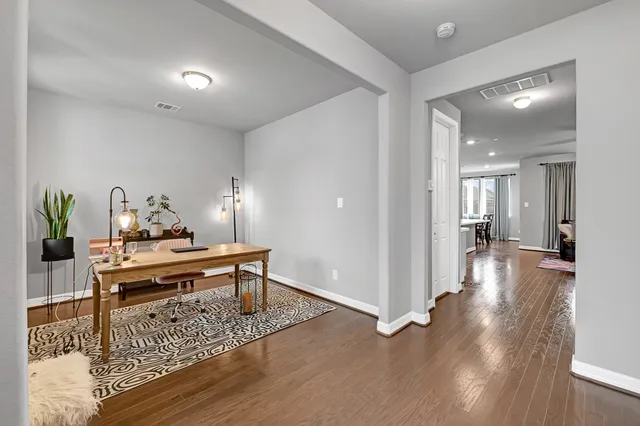 a view of a living room and dining room