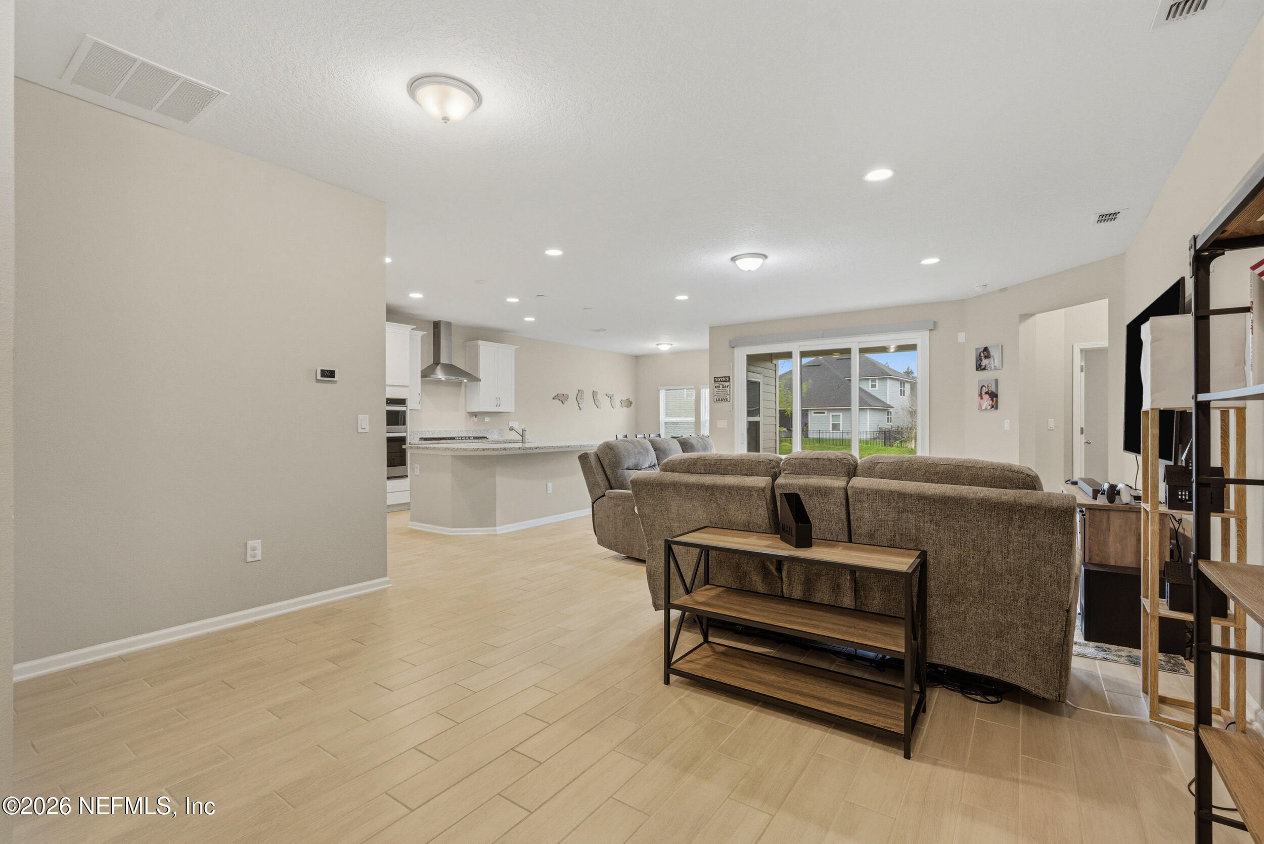 635 Sycamore Way Orange Park, FL 32073 - Photo 13 of 42 a living room with furniture and a table