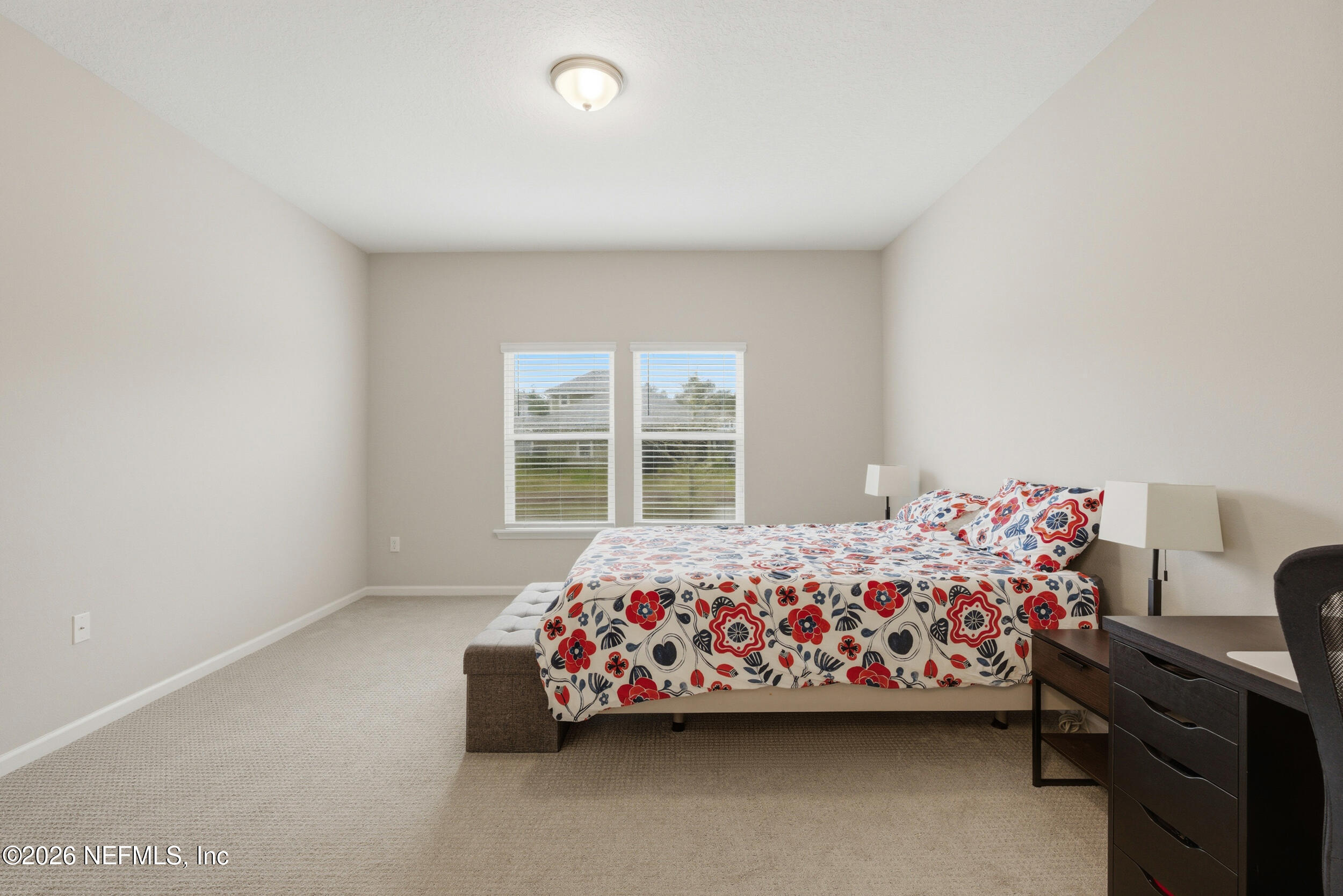 635 Sycamore Way Orange Park, FL 32073 - Photo 16 of 42 a bedroom with a bed and a window