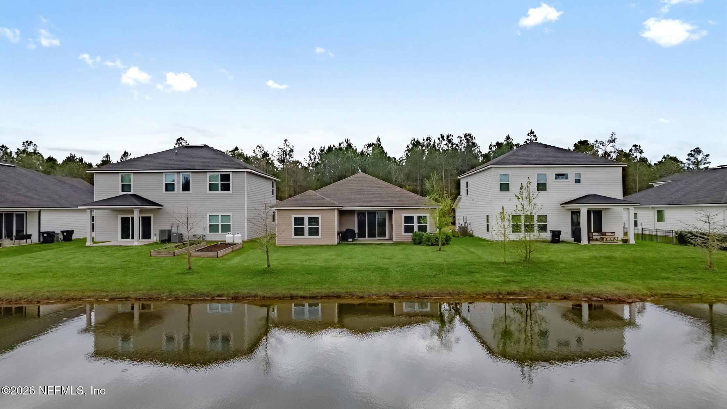 635 Sycamore Way Orange Park, FL 32073 - Photo 26 of 42 a front view of a house with a yard and garage