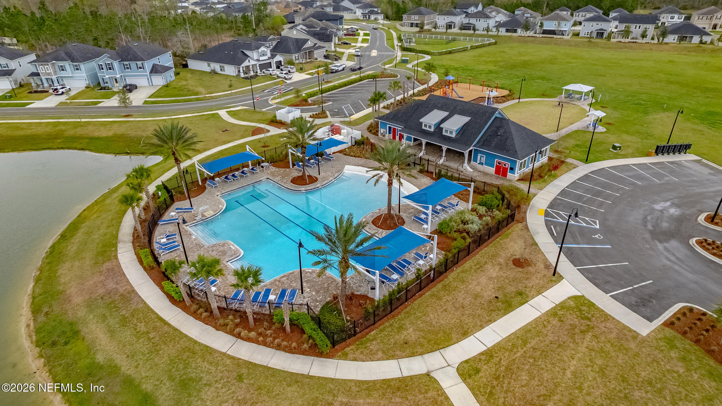 635 Sycamore Way Orange Park, FL 32073 - Photo 33 of 42 an aerial view of a swimming pool with a table and chairs