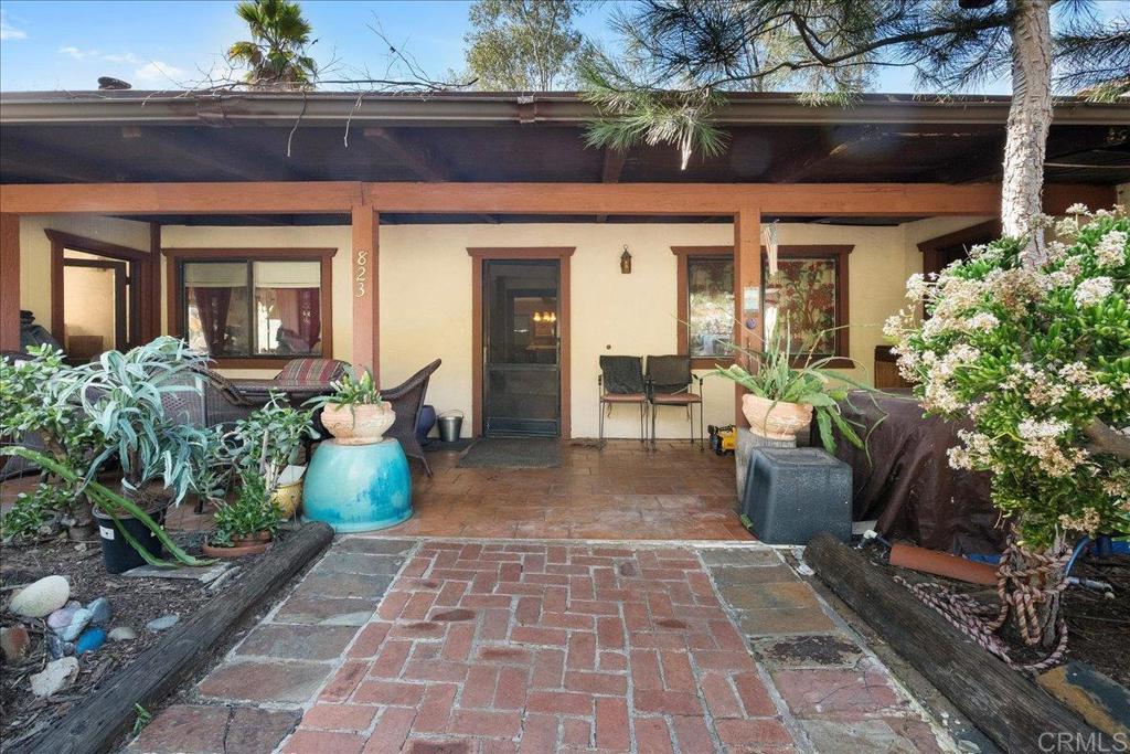 823 Rice Canyon Road Fallbrook, CA 92028 - Photo 15 of 31 a view of a brick house with potted plants