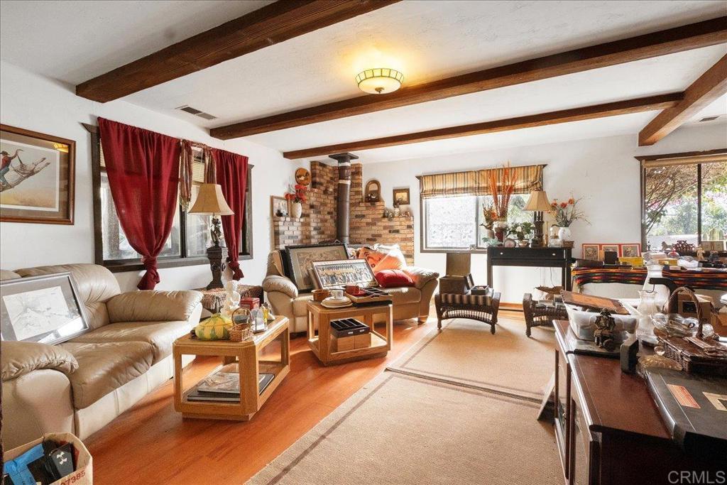823 Rice Canyon Road Fallbrook, CA 92028 - Photo 16 of 31 a living room with furniture a rug and a large window