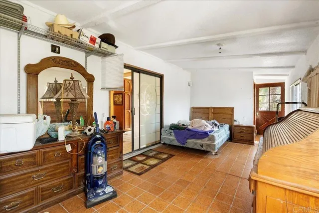 a bedroom with bed and window