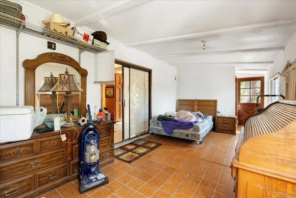 823 Rice Canyon Road Fallbrook, CA 92028 - Photo 24 of 31 a bedroom with furniture and wooden floor