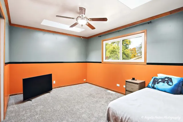 a bedroom with bed and window