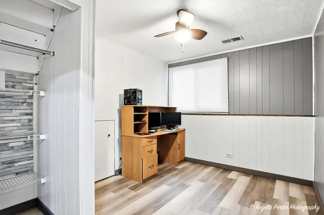 a view of a kitchen with a sink and a refrigerator