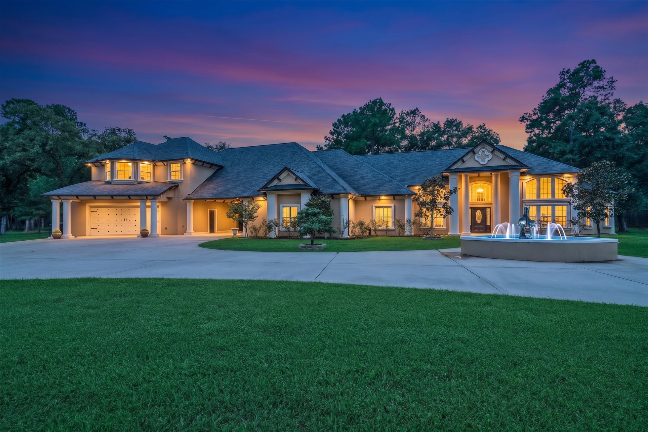 32660 Willow Bend Road Waller, TX 77484 - Photo 1 of 47 Beautifully illuminated residence showcasing an impressive architectural design, expansive lawn, and inviting outdoor living areas.