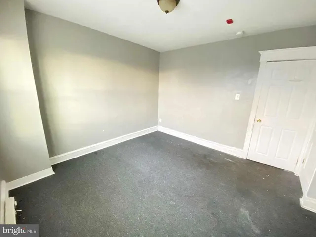 an empty room with a door