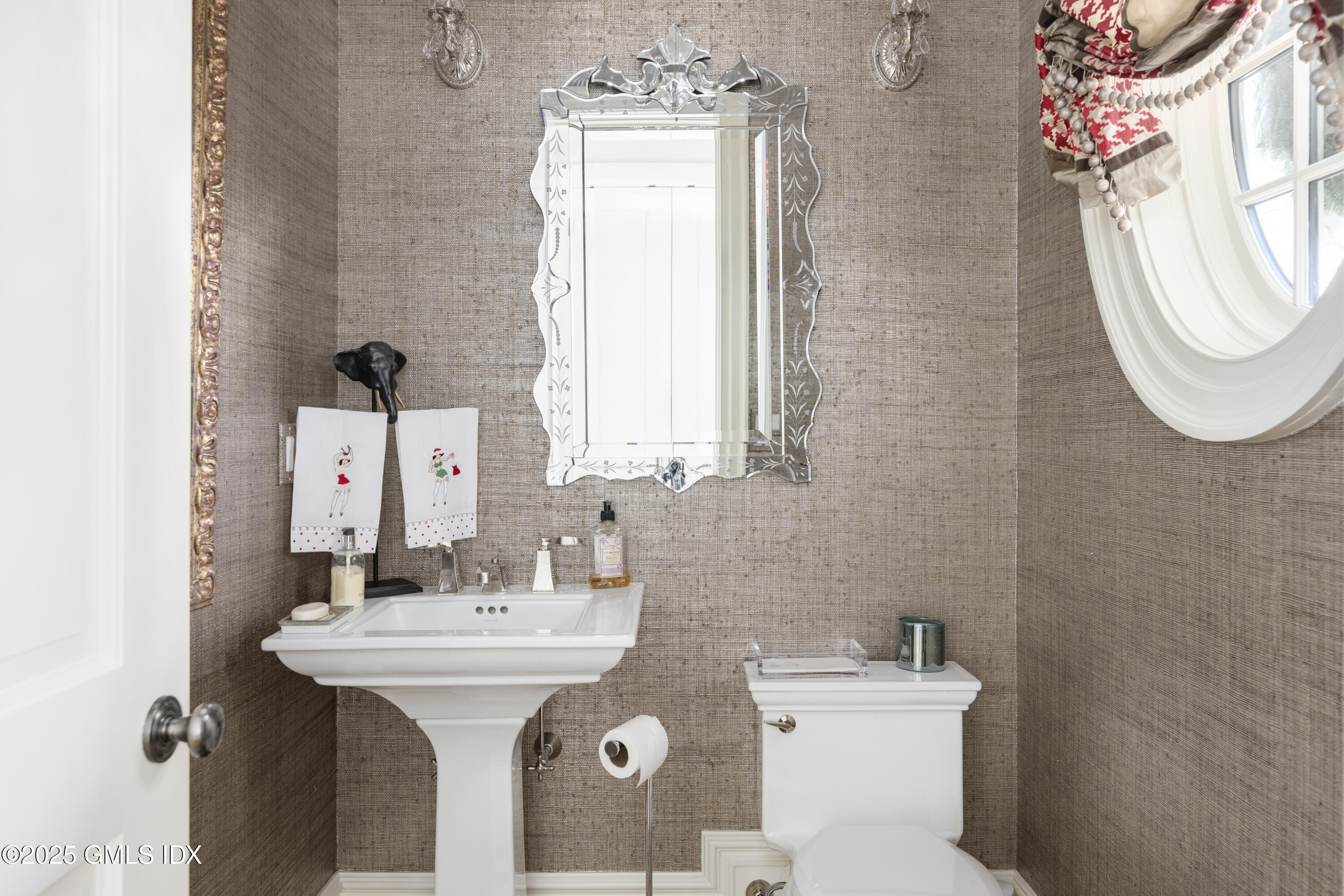 50 Sound View Drive, Unit 2N Greenwich, CT 06830 - Photo 13 of 37 a bathroom with a sink mirror and toilet