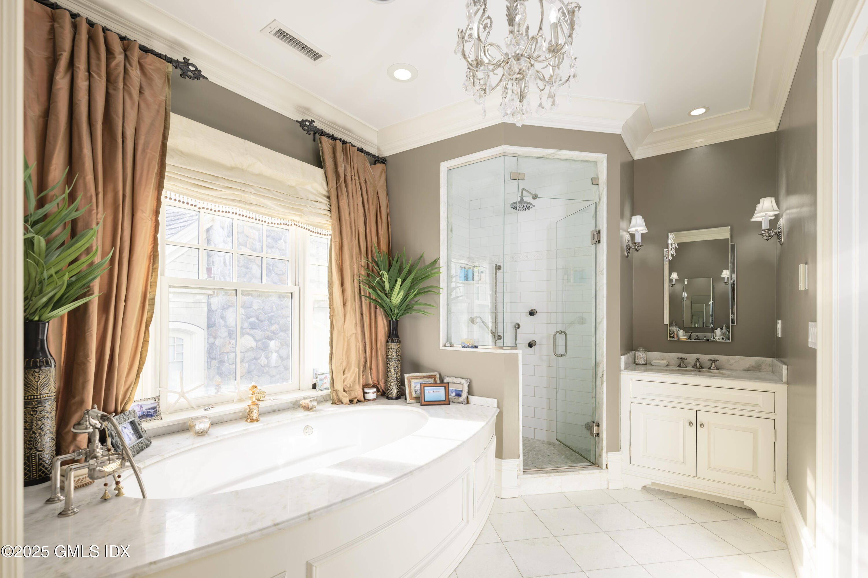 50 Sound View Drive, Unit 2N Greenwich, CT 06830 - Photo 16 of 37 a spacious bathroom with a granite countertop sink a mirror and a bathtub