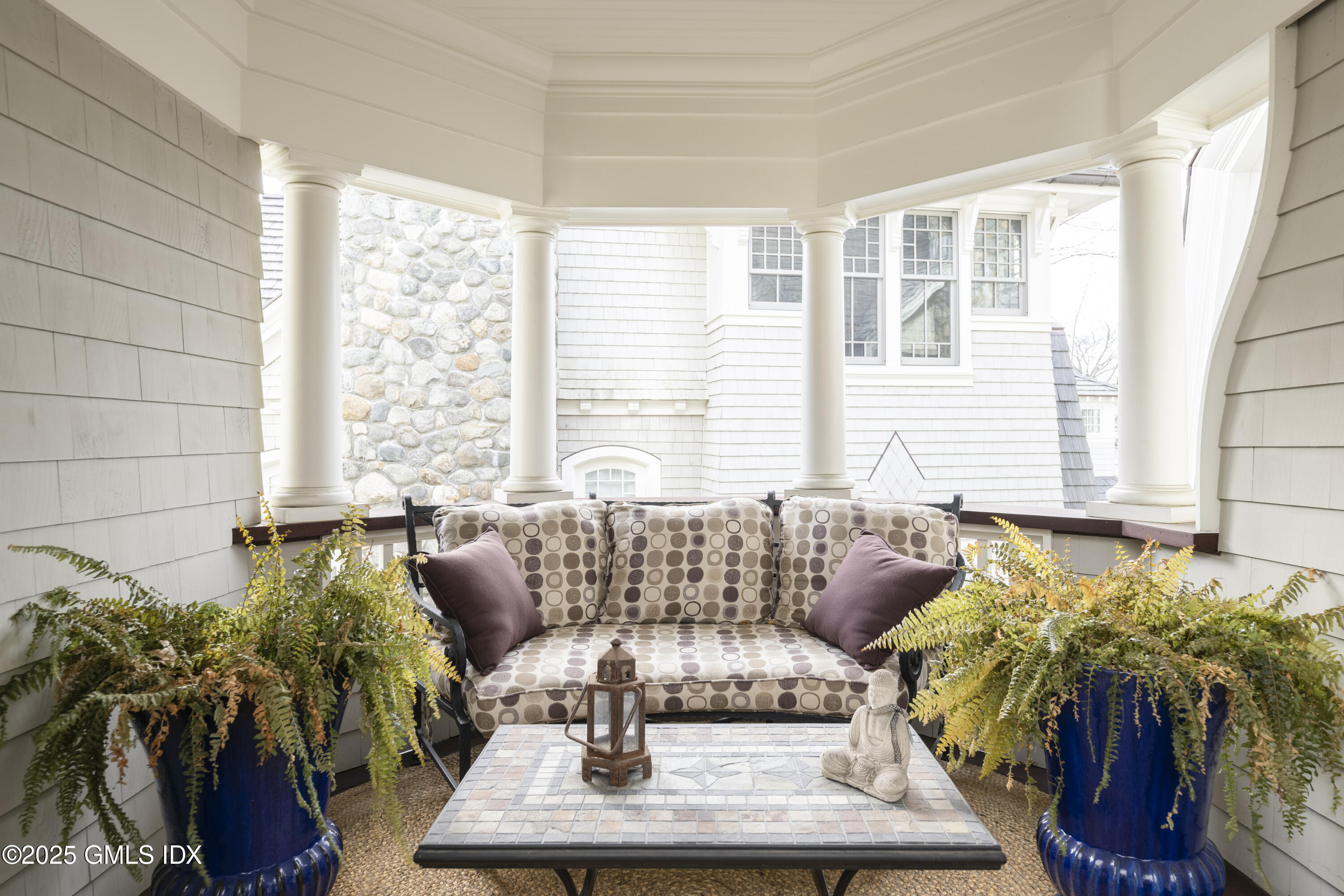 50 Sound View Drive, Unit 2N Greenwich, CT 06830 - Photo 20 of 37 a living room with furniture and a large window