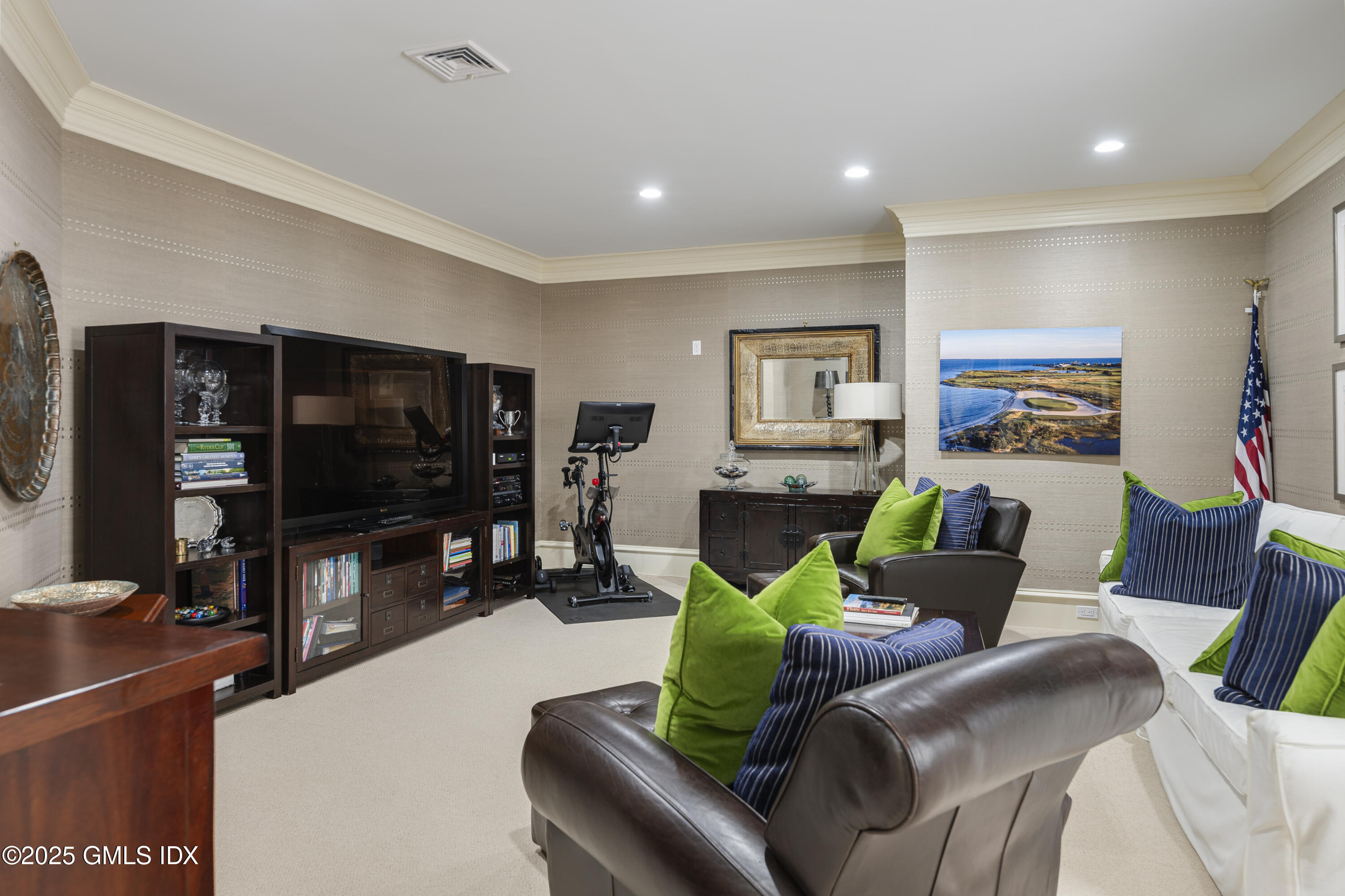 50 Sound View Drive, Unit 2N Greenwich, CT 06830 - Photo 24 of 37 a living room with furniture and a flat screen tv