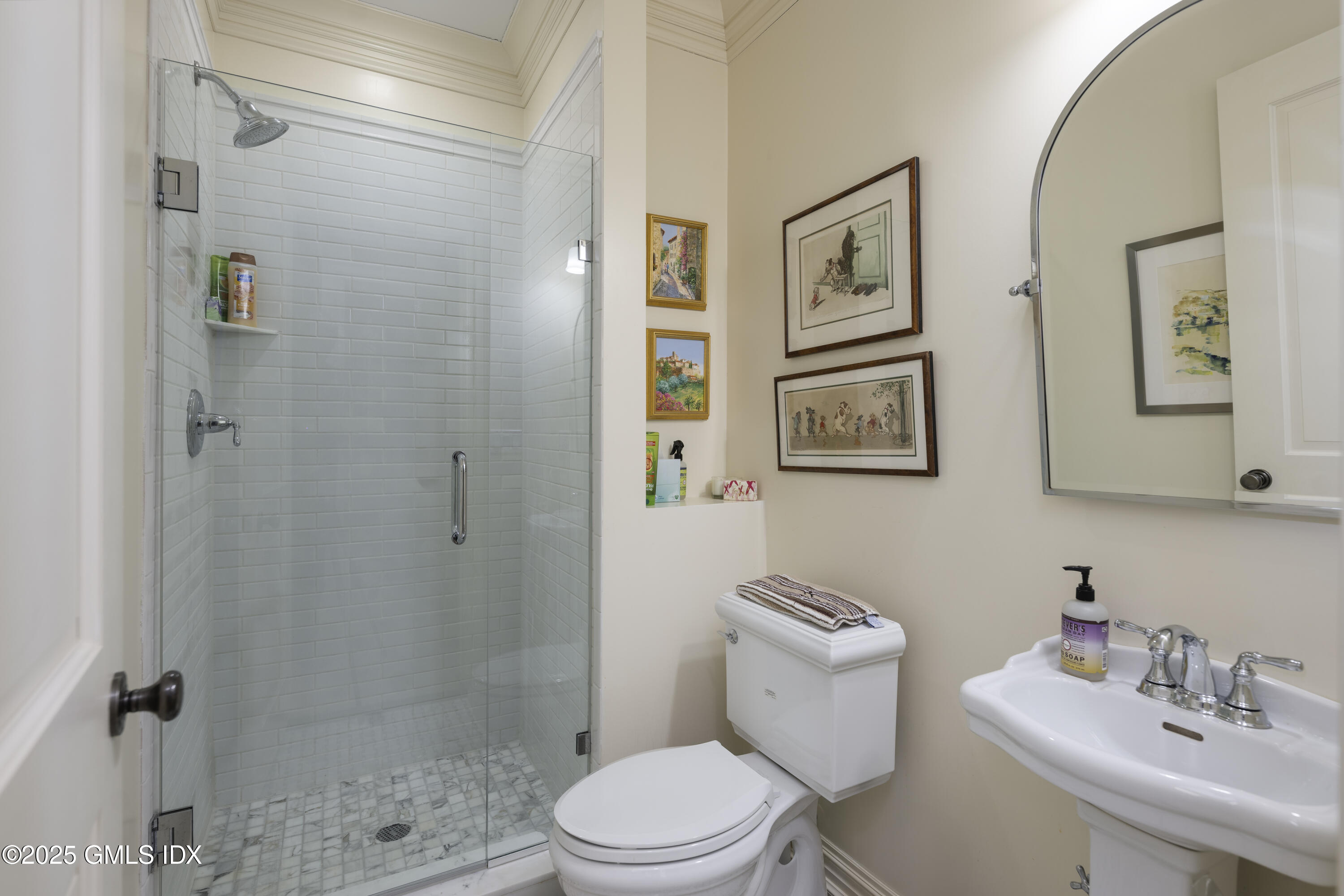 50 Sound View Drive, Unit 2N Greenwich, CT 06830 - Photo 26 of 37 a bathroom with a toilet a sink and shower