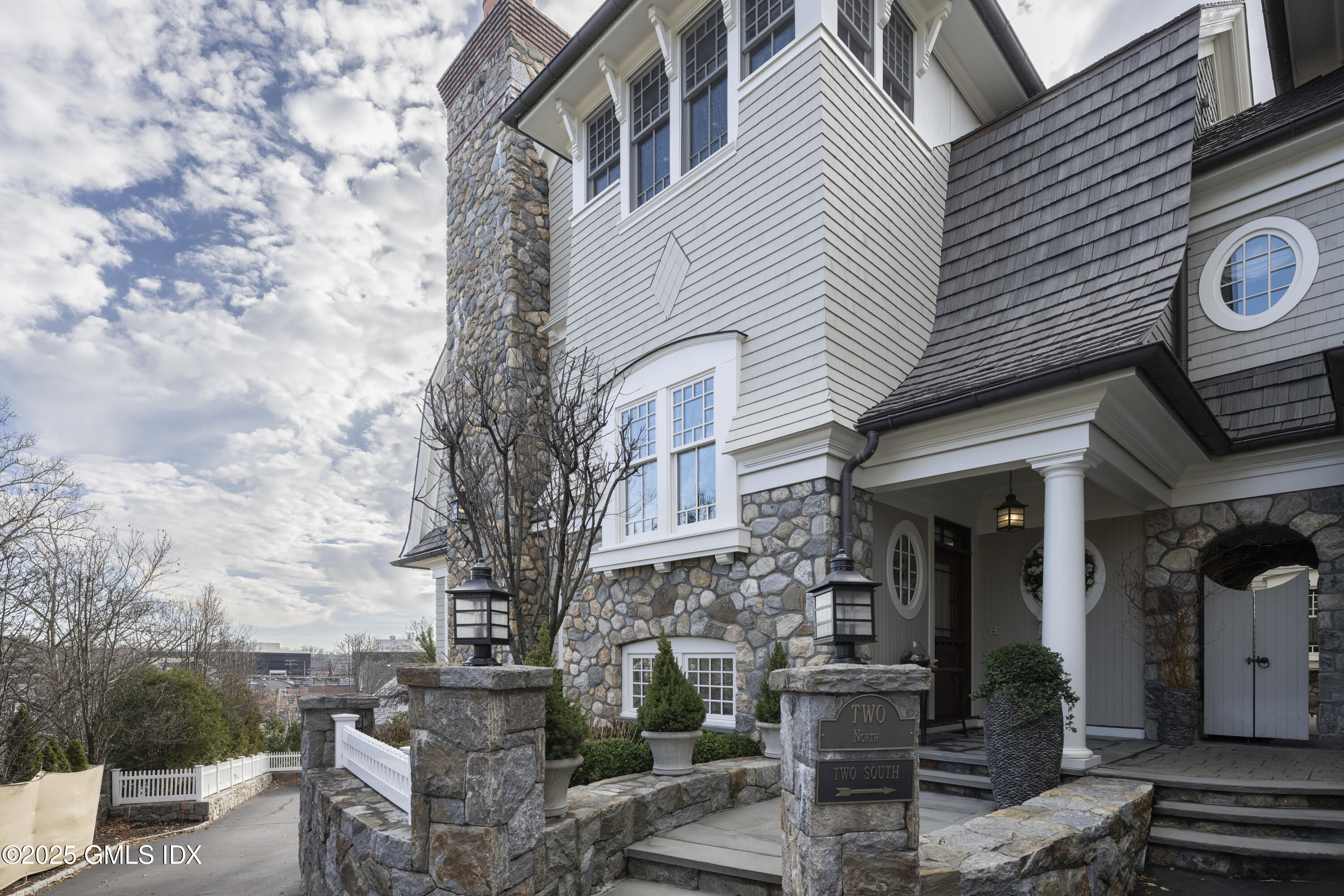 50 Sound View Drive, Unit 2N Greenwich, CT 06830 - Photo 30 of 37 a view of a white building among the street