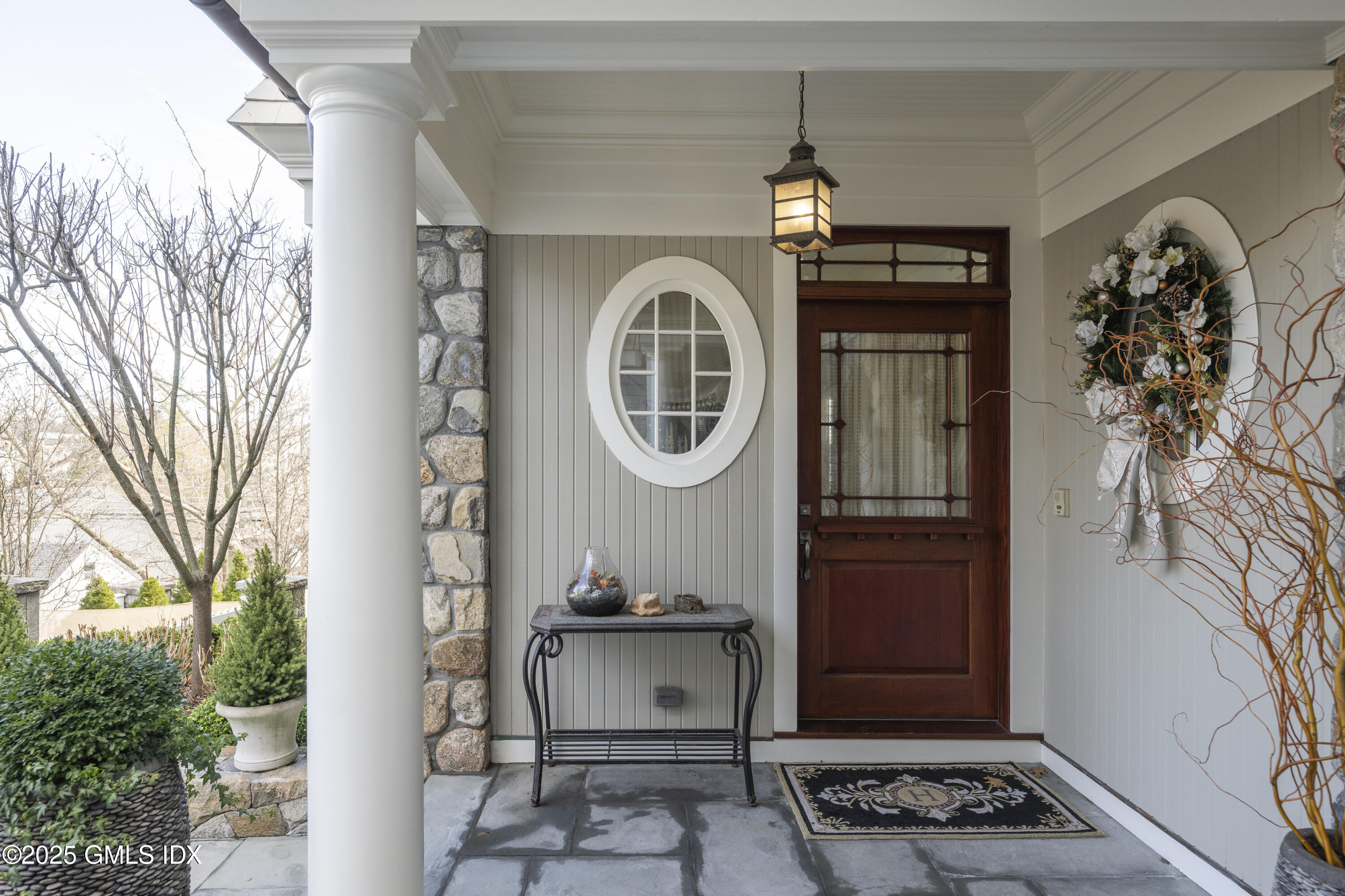 50 Sound View Drive, Unit 2N Greenwich, CT 06830 - Photo 3 of 37 a front view of a house with garden