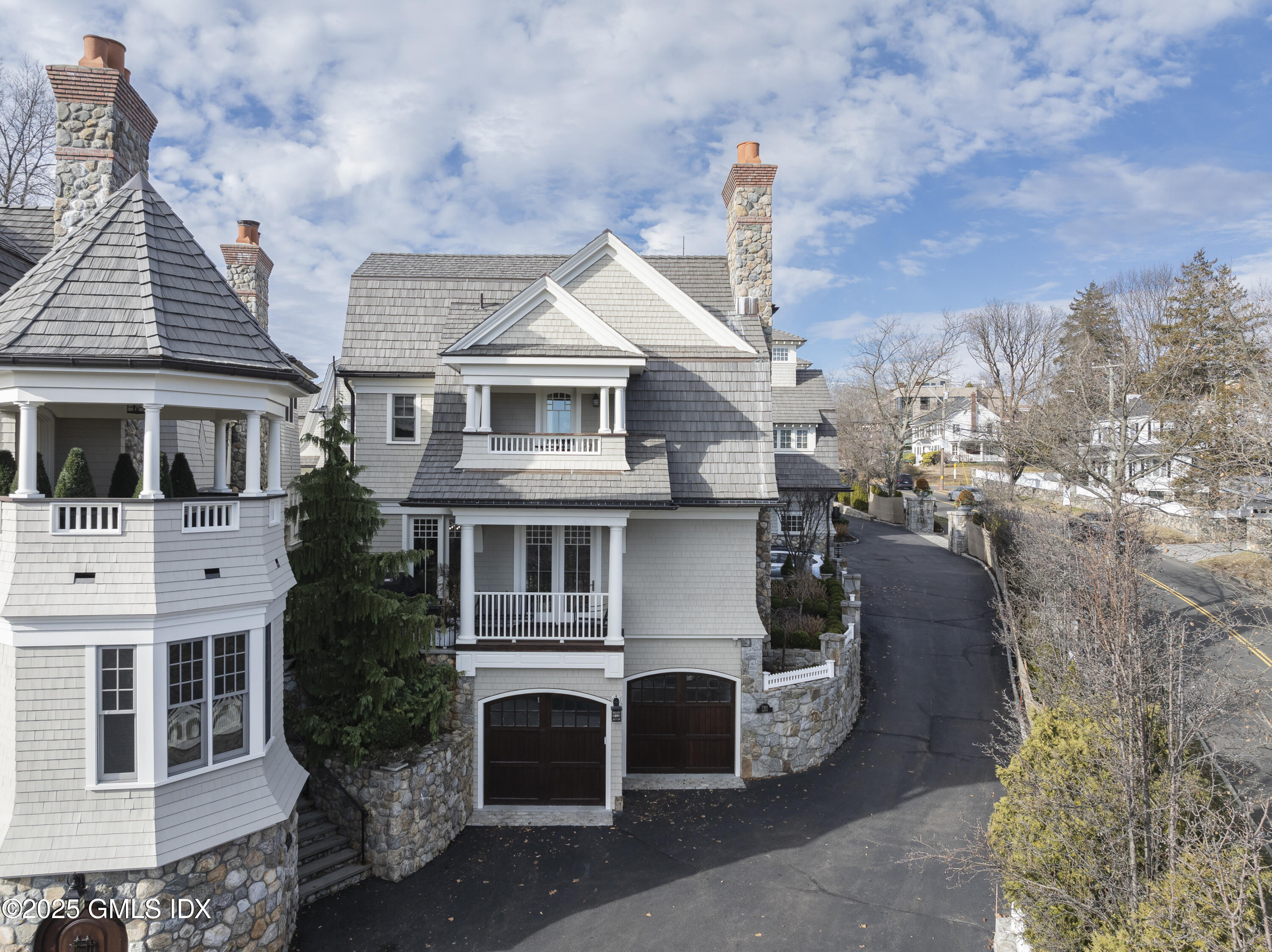 50 Sound View Drive, Unit 2N Greenwich, CT 06830 - Photo 31 of 37 a view of a house with a yard