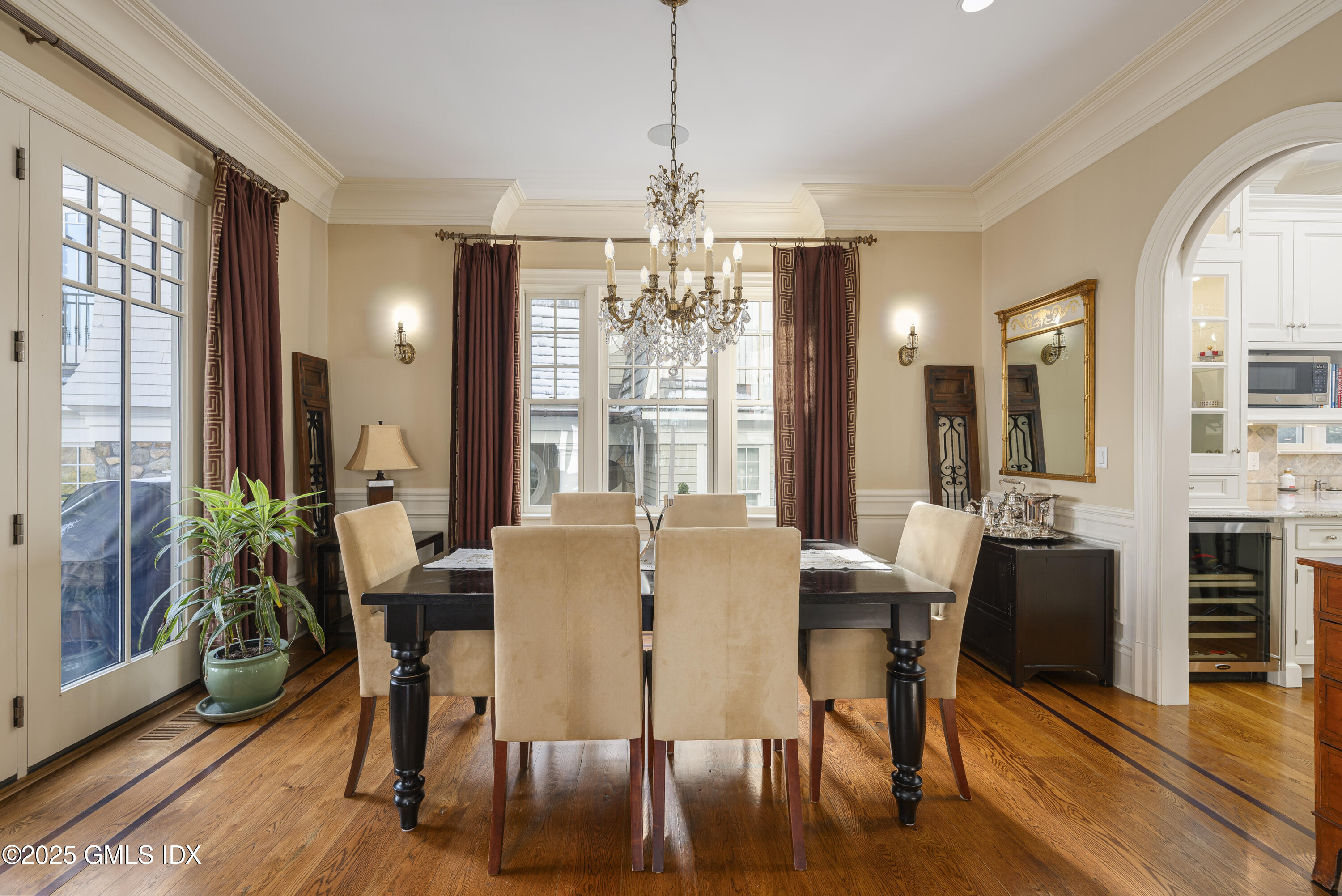 50 Sound View Drive, Unit 2N Greenwich, CT 06830 - Photo 7 of 37 a view of a dining room with furniture window and wooden floor