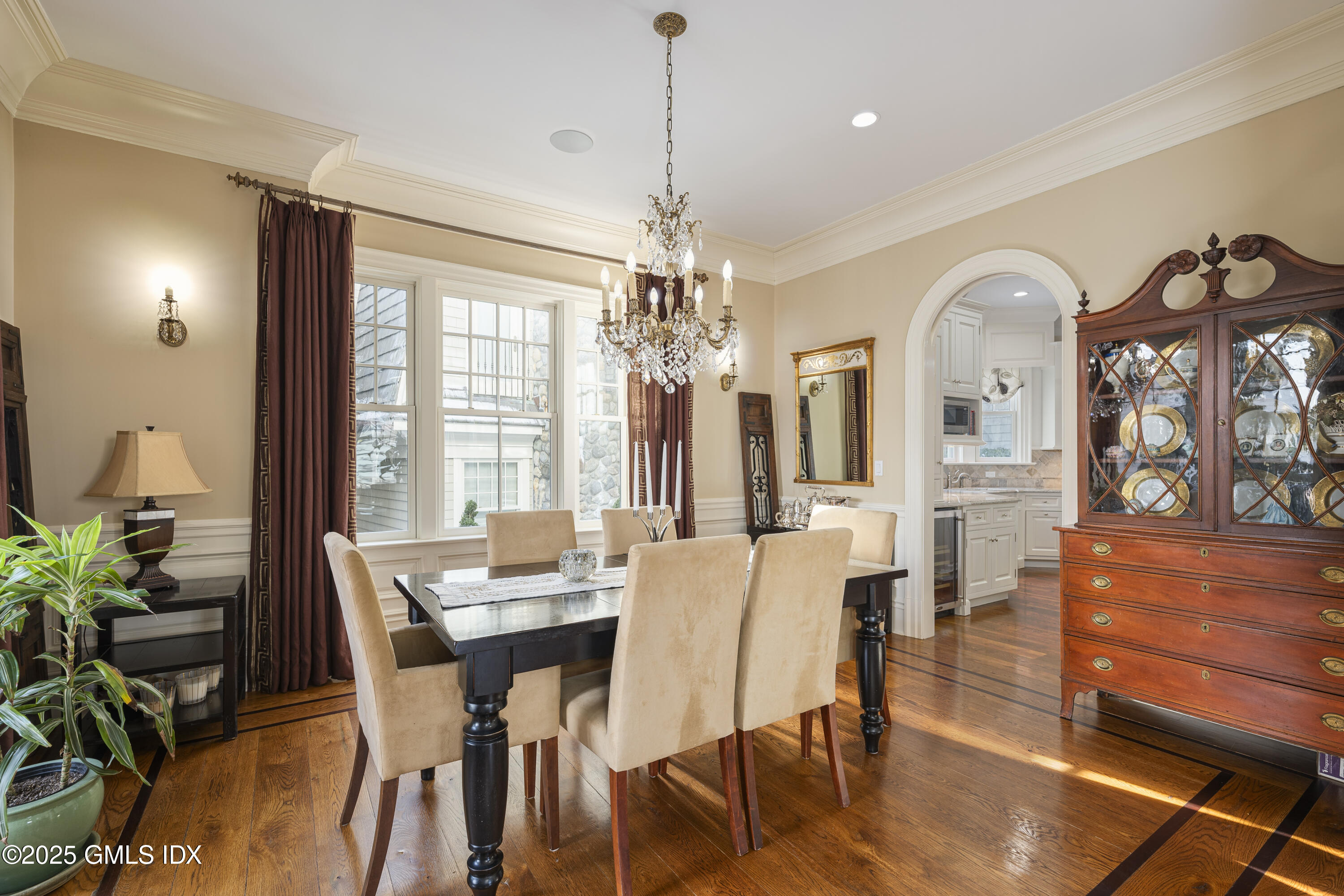 50 Sound View Drive, Unit 2N Greenwich, CT 06830 - Photo 8 of 37 a view of a dining room with furniture window and wooden floor