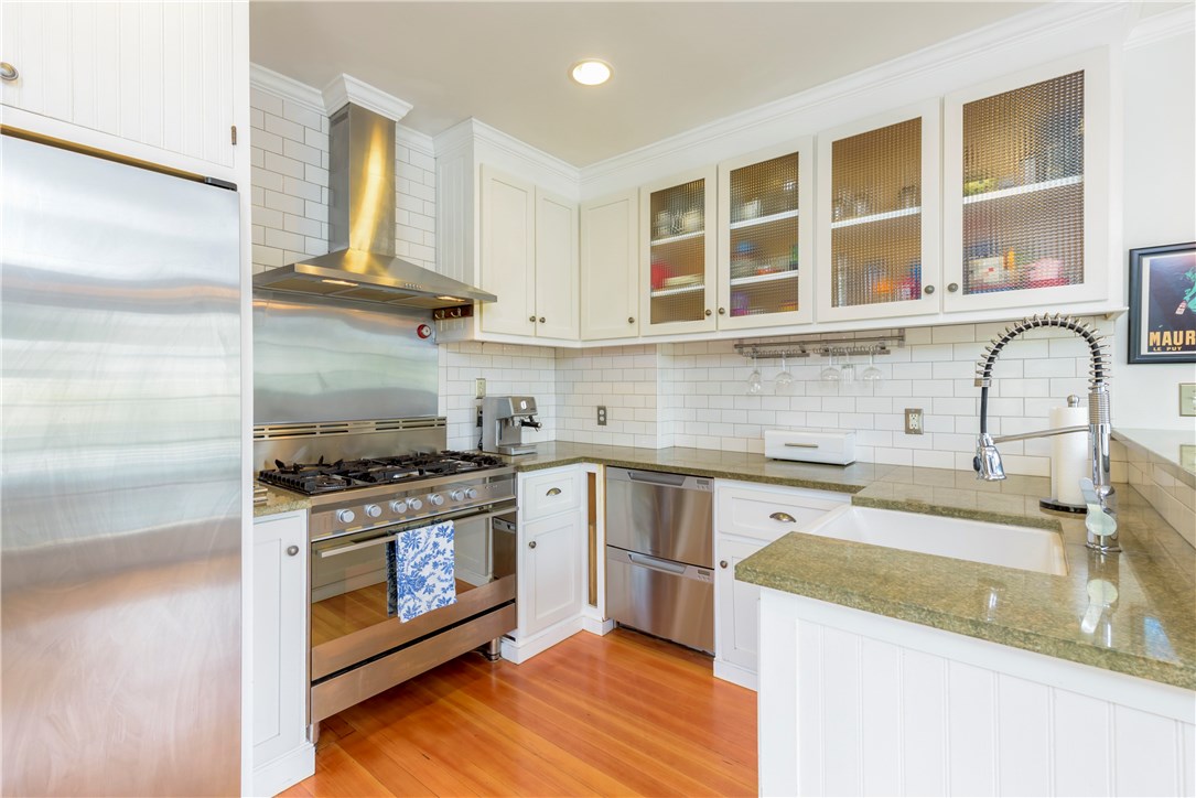 36 Post Road Warwick, RI 02888 - Photo 5 of 23 Microwave is hidden near the pantry.