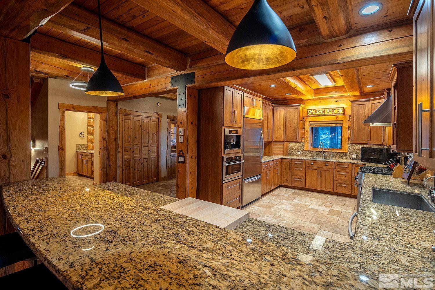 2710 Goldfield Road Reno, NV 89521 - Photo 8 of 39 a view of a kitchen with furniture and a kitchen view