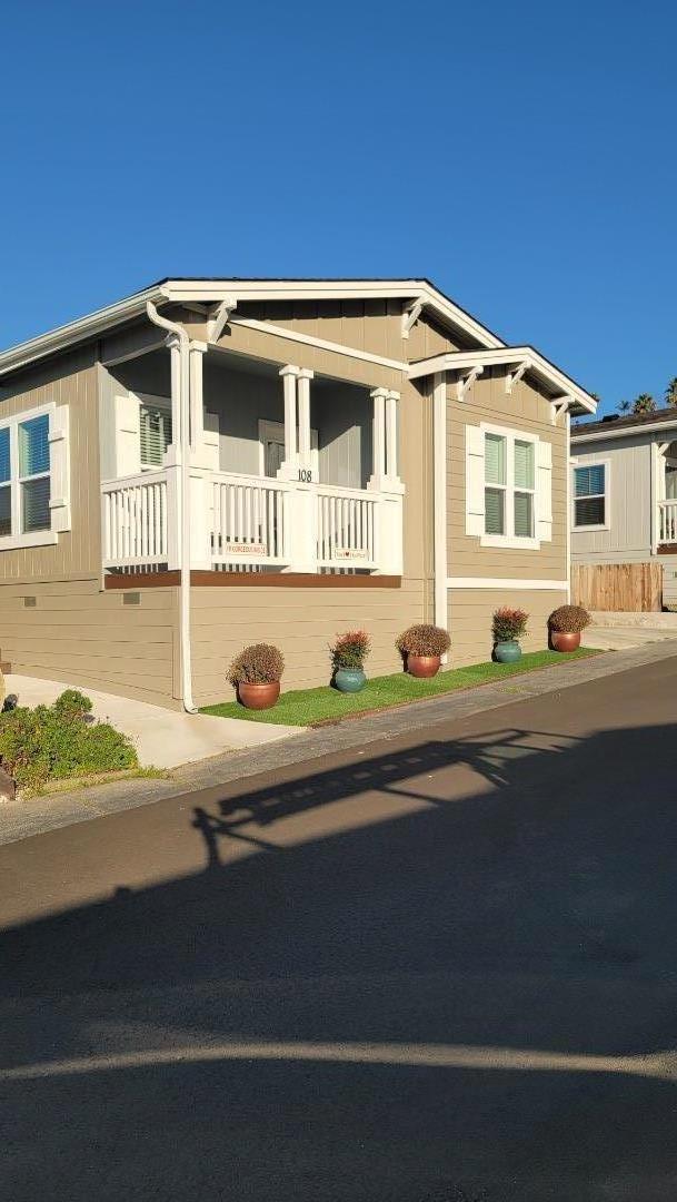 100 North Rodeo Gulch Road, Unit 108 Soquel, CA 95073 - Photo 12 of 16 a front view of a house with a yard