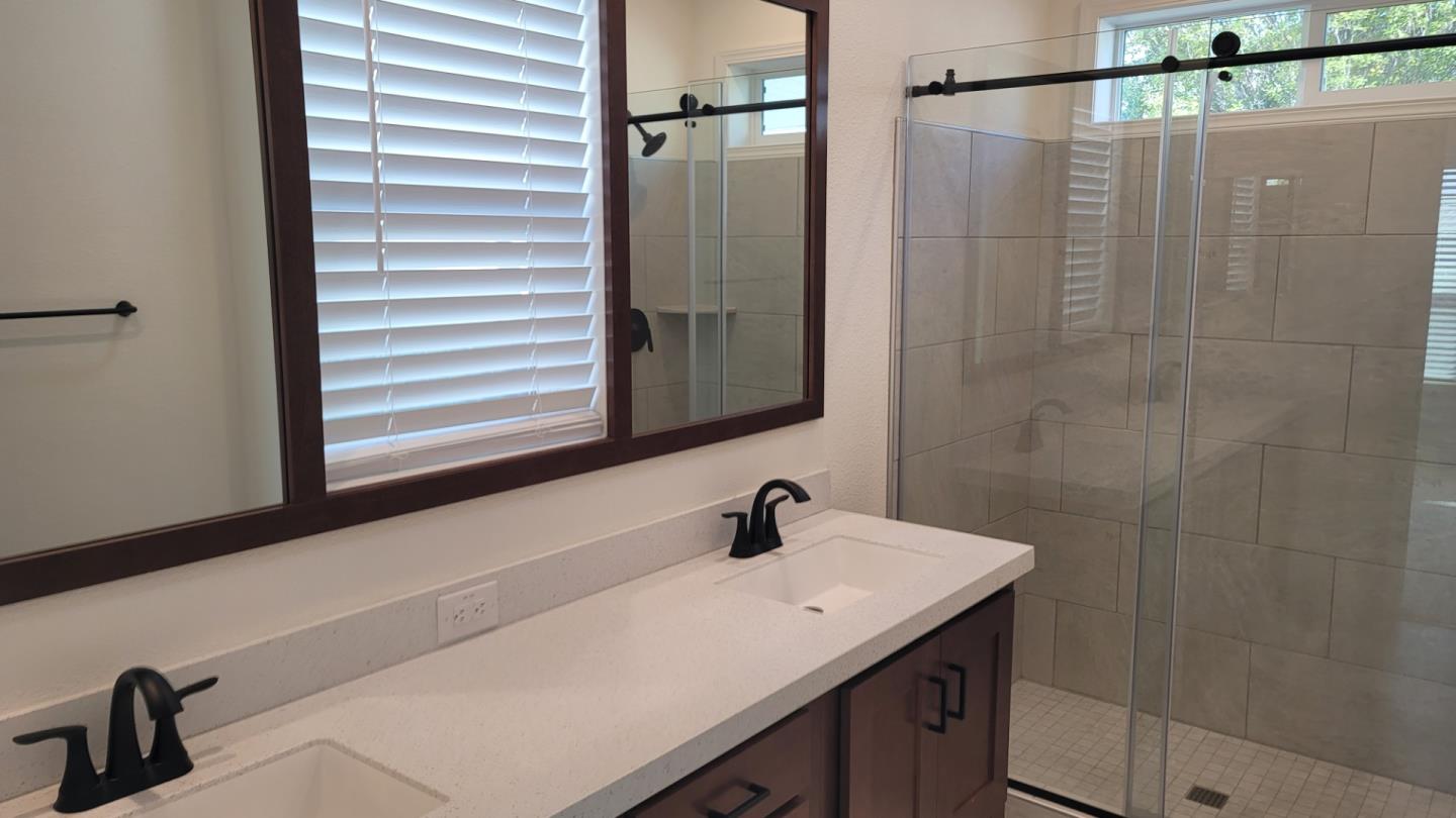100 North Rodeo Gulch Road, Unit 108 Soquel, CA 95073 - Photo 4 of 16 a bathroom with a sink and a mirror