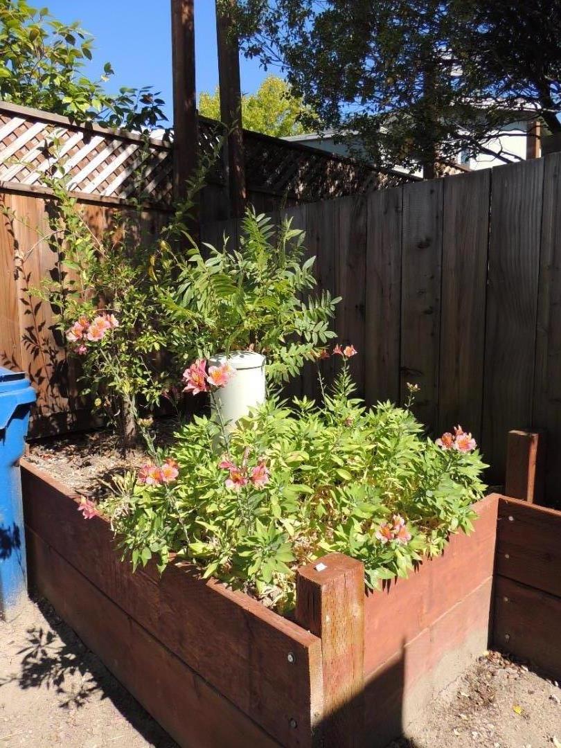 100 North Rodeo Gulch Road, Unit 108 Soquel, CA 95073 - Photo 6 of 16 a wooden fence with some plants