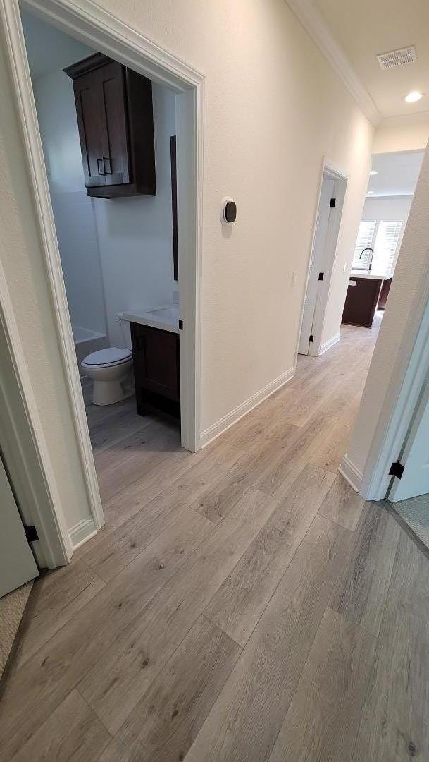 100 North Rodeo Gulch Road, Unit 108 Soquel, CA 95073 - Photo 9 of 16 a view of a hallway with wooden floor and a bathroom