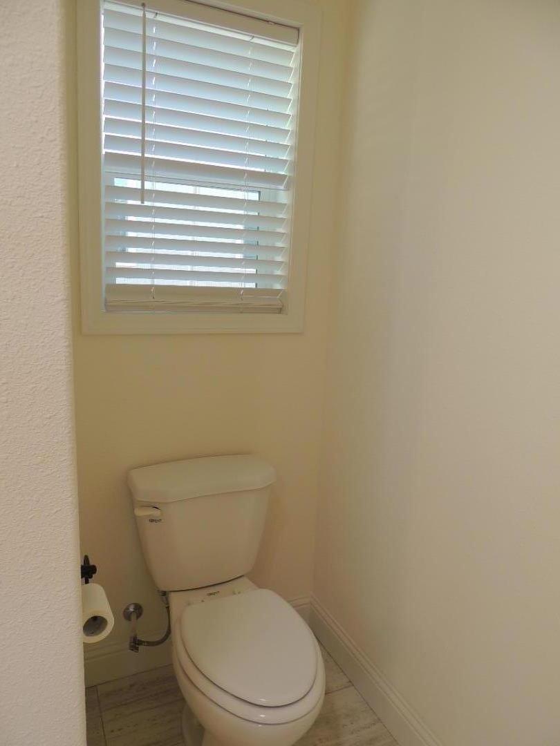 100 North Rodeo Gulch Road, Unit 108 Soquel, CA 95073 - Photo 10 of 16 a white toilet sitting next to a window