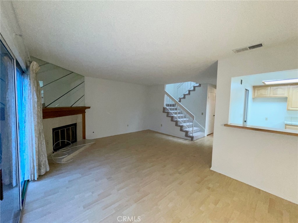 19500 Crystal Ridge Lane Porter Ranch, CA 91326 - Photo 11 of 33 a view of a livingroom with a fireplace and a window