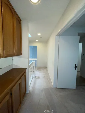 a kitchen with a sink and a refrigerator