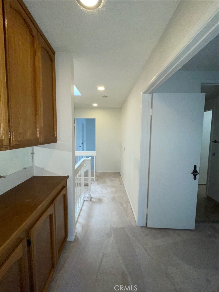 19500 Crystal Ridge Lane Porter Ranch, CA 91326 - Photo 15 of 33 a kitchen with a sink and a refrigerator