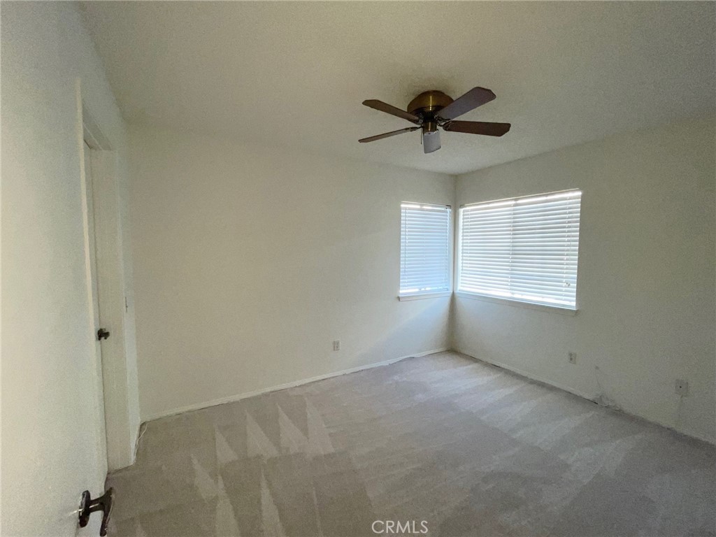 19500 Crystal Ridge Lane Porter Ranch, CA 91326 - Photo 18 of 33 a view of a room with a ceiling fan and window