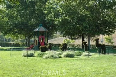 a view of a table and chairs under an umbrella