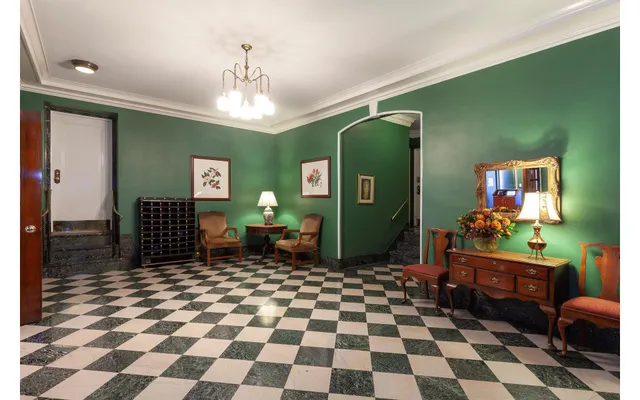 a bedroom with a bed and a mirror