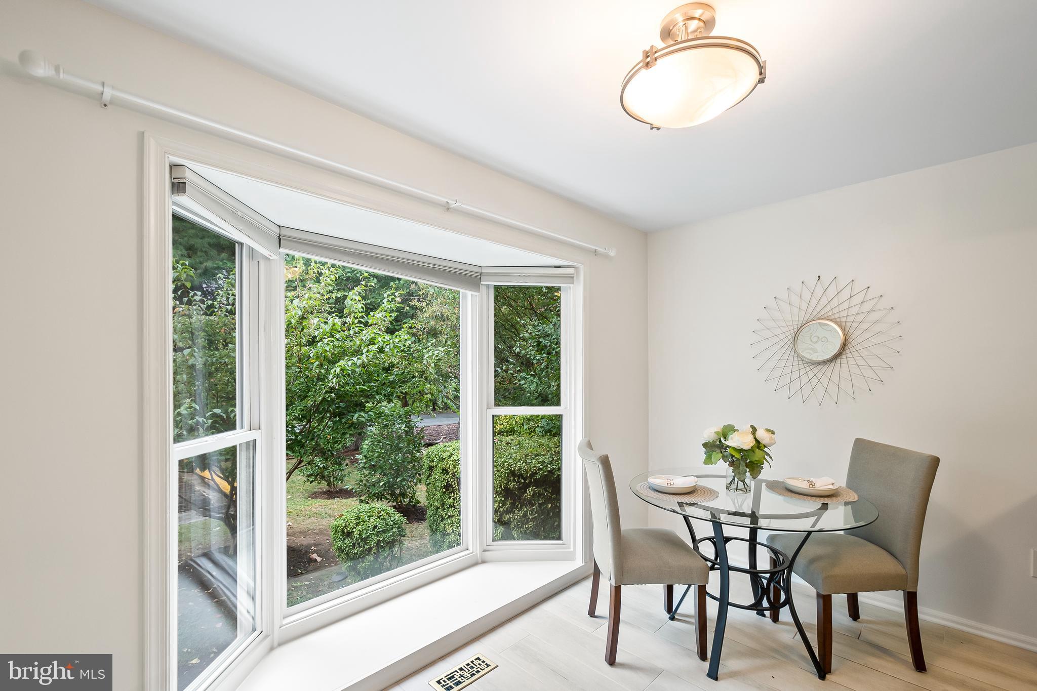 7443 Crestberry Lane Bethesda, MD 20817 - Photo 12 of 46 a view of a dining room with furniture window and outside view