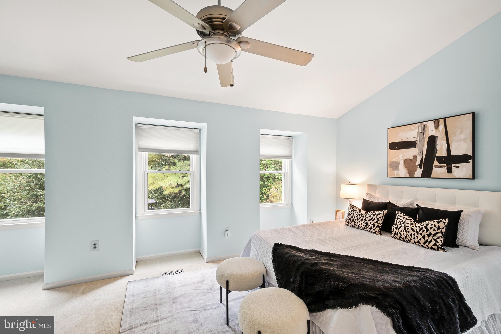 7443 Crestberry Lane Bethesda, MD 20817 - Photo 21 of 46 a bedroom with a bed and wooden floor